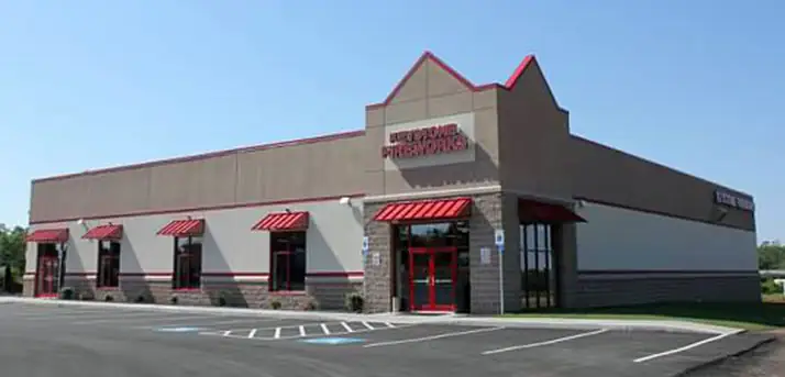 Keystone Greencastle storefront with red awnings and the front parking lot